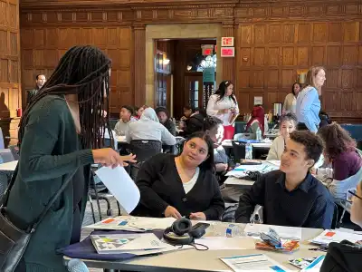 Students speaking with mentor at Prudential's Innovation Challenge